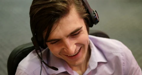 Young man working in a call center Stock Footage 67254188