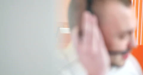 Young man working in a call center Stock Footage 67272659