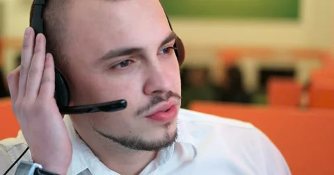 Young man working in a call center Stock Footage 67275917