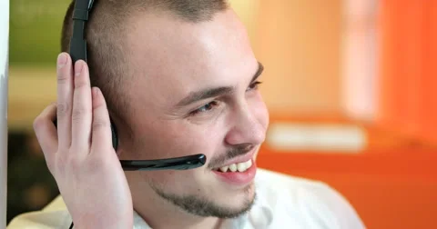 Young man working in a call center Stock Footage 67278285