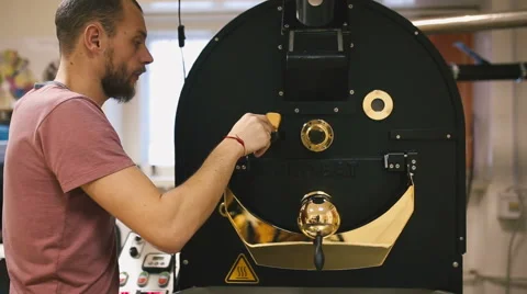 Young man working with a coffee machine Stock Footage 58957514