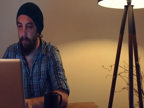 Young man working with computer and drink coffee 動画素材 72189874