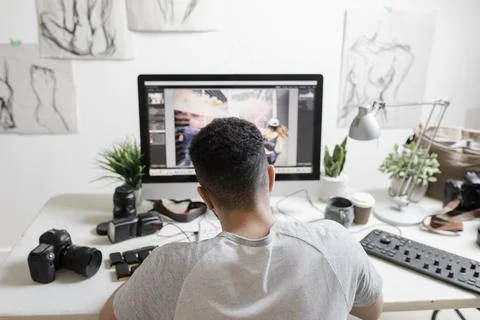 Young man working on computer in creative studio 스톡 사진