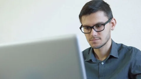 Young man working on a computer Stock Footage