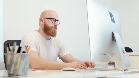 Young man working with computer Stock-Footage 96489699