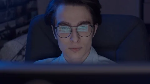 Young man working at computer Stock Footage 128026665