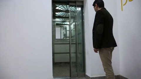 Young man is working on a computer - laptop computer showing charts and graphs.  Stock Footage 81470427