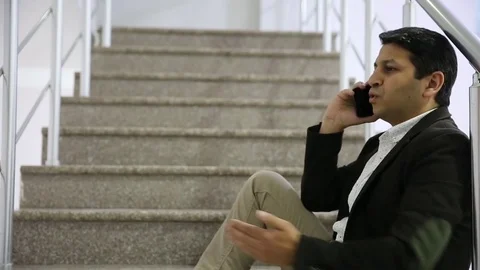 Young man is working on a computer - laptop computer showing charts and graphs.  Stock Footage 81470439