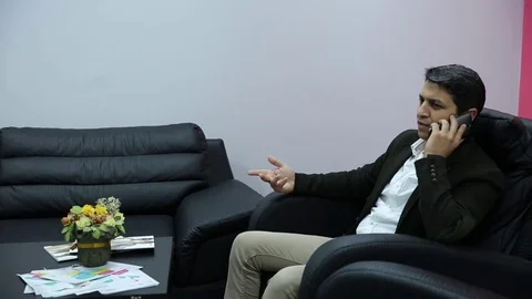 Young man is working on a computer - laptop computer showing charts and graphs.  Stock Footage 81470469