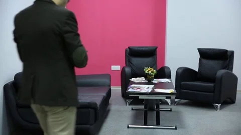 Young man is working on a computer - laptop computer showing charts and graphs.  Stock Footage 81470481