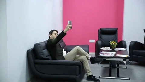 Young man is working on a computer - laptop computer showing charts and graphs.  Stock Footage 81470503