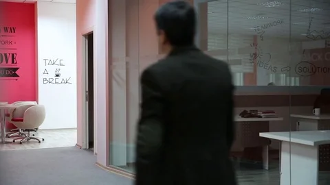 Young man is working on a computer - laptop computer showing charts and graphs.  Stock Footage 81470574