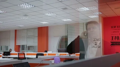 Young man is working on a computer - laptop computer showing charts and graphs.  Stock Footage 81470808