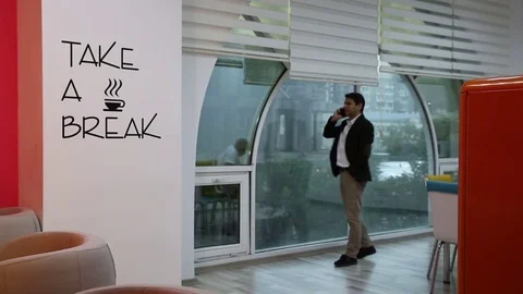 Young man is working on a computer - laptop computer showing charts and graphs.  Stock Footage 81470925