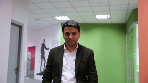 Young man is working on a computer - laptop computer showing charts and graphs.  Stock Footage 81470929