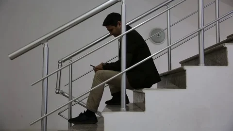 Young man is working on a computer - laptop computer showing charts and graphs.  Stock Footage 81471013