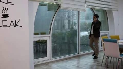 Young man is working on a computer - laptop computer showing charts and graphs.  Stock Footage 81471026