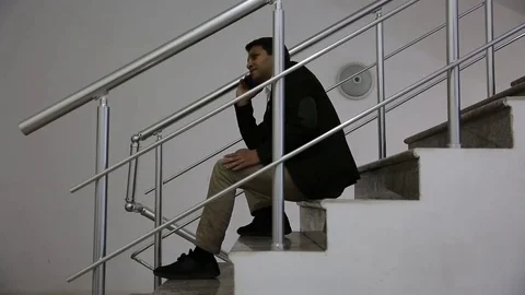 Young man is working on a computer - laptop computer showing charts and graphs.  Stock Footage 81471041