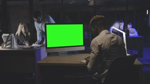 Young man working at computer late at night Stock Footage 125683837