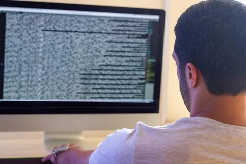Young man working on computer in office 库存照片