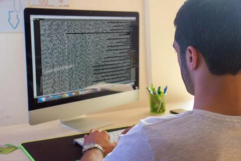 Young man working on computer in office 库存照片