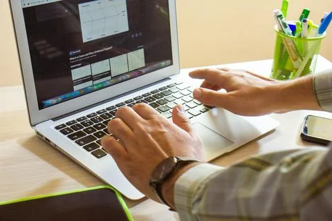 Young man working on computer in office Stock Photos