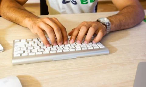 Young man working on computer in office Stock Photos