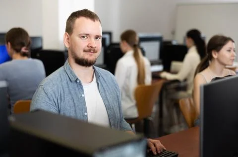 Young man working on computer in office Stock Photos