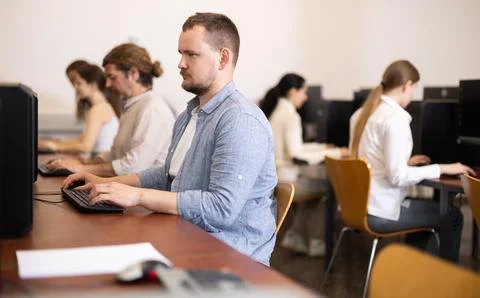 Young man working on computer in office Stock Photos