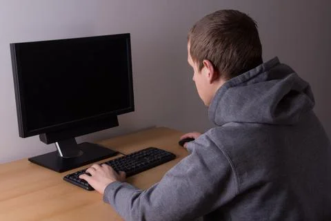 Young man working with a computer Stockfoto's