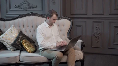 A young man working at a computer. Remote work, freelance. Stock Footage 121318552