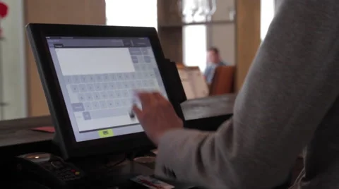 Young man working on the computer in the restaurant Видео 58856139