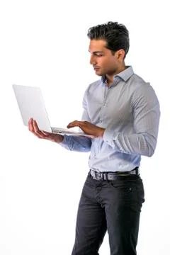 Young man working with computer standing Stock Photos