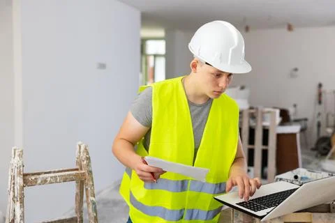 Young man working in construction site 스톡 사진