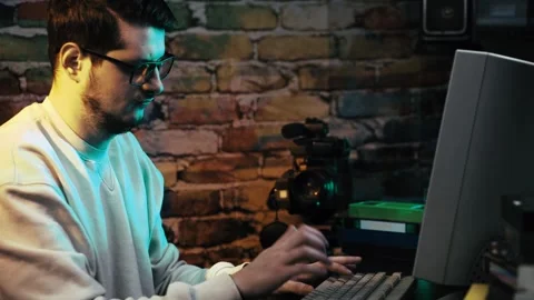 Young Man Working on Desktop PC Computer From 1990s. Close Up Stock Footage 301696011