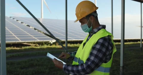 Young man working with digital tablet on solar power station Stock Footage 149302559
