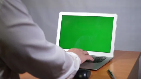 A young man working on a green screen computer Video stock 164059032