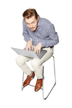 Young man working hard on a computer Foto stock
