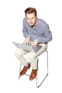 Young man working hard on a computer Stock Photos