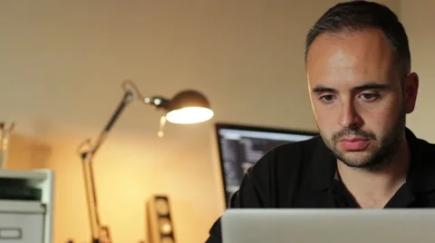 Young man working in his office Stock Footage 55138472