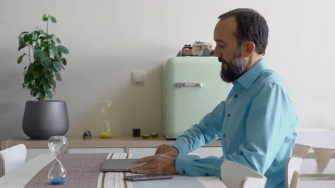 Young man working at home Stock Footage 122386864