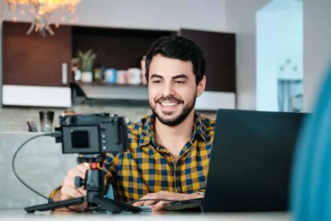 Young Man Working From Home Making Business Web Conference Stock Photos