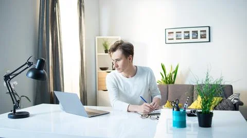 Young Man Working from Home Stock-Fotos