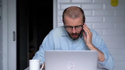 Young man is working from home using smartphone to communicate with colleagues. Stock Footage 135981021