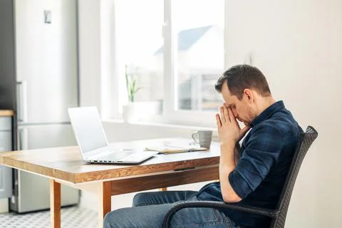 Young man working from home using laptop. Foto stock