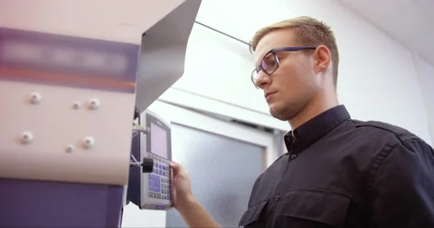 Young Man Working On Industrial Experiment Stock Footage 142892468