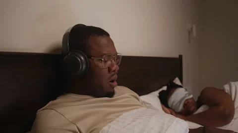 Young Man Working on Laptop in Bed Stock Footage 328516613