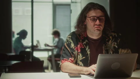 Young Man Working on Laptop in Dark Office during Night Stock Footage 340495158