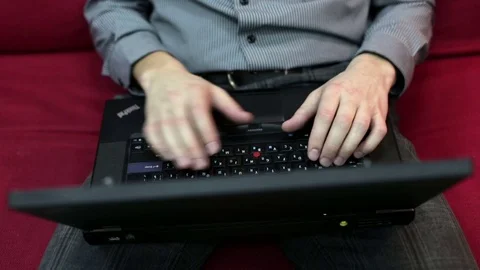 Young man working at a laptop Stock Footage 72341061