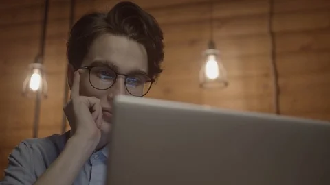 Young man working with laptop Stock Footage 125080242